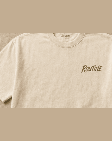 Front of the cream El Spot harbor tee with a small olive ROUTINE script on the chest.