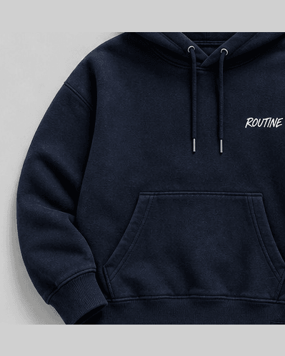 Navy fleece hoodie with a small white ROUTINE script on the chest.
