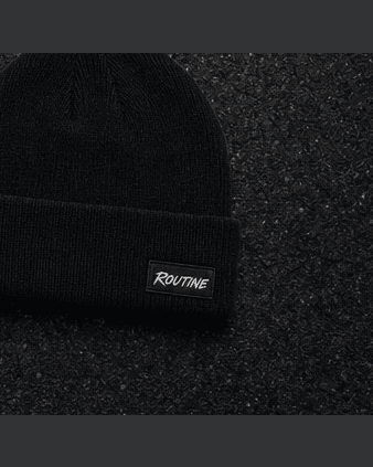 Black Night Drive beanie with a small woven ROUTINE label on the cuff.