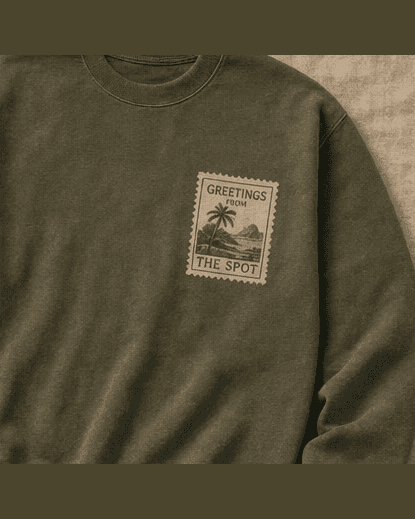 Olive El Spot crewneck with a Greetings from The Spot stamp on the chest.