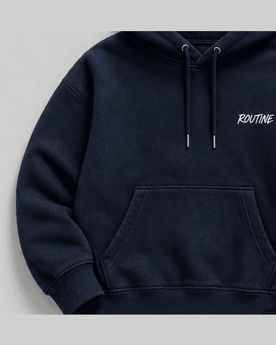 Navy fleece hoodie with a small white ROUTINE script on the chest.