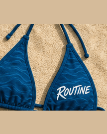 Ocean blue La Isla bikini top with a white ROUTINE script.